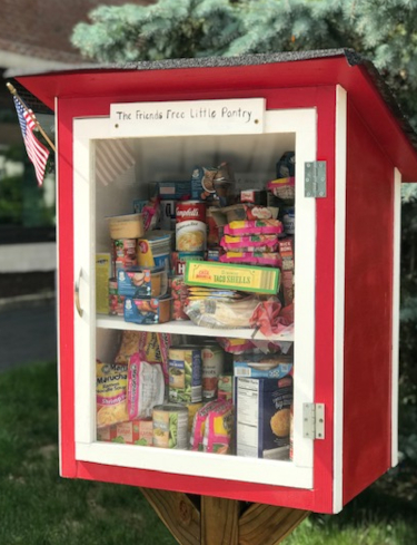 Here we see the free little pantry. It's a sweet little box full of food that people can access 24/7.