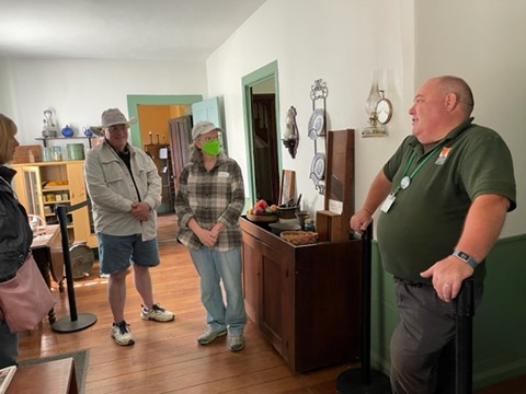 Here we see a Metroparks employee give attendees a tour of the Benjamin Bacon Museum.