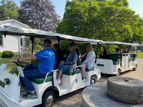 Attendees board a tram to tour the park at the Lorain County Metro Parks. It looks like a beautiful day.
